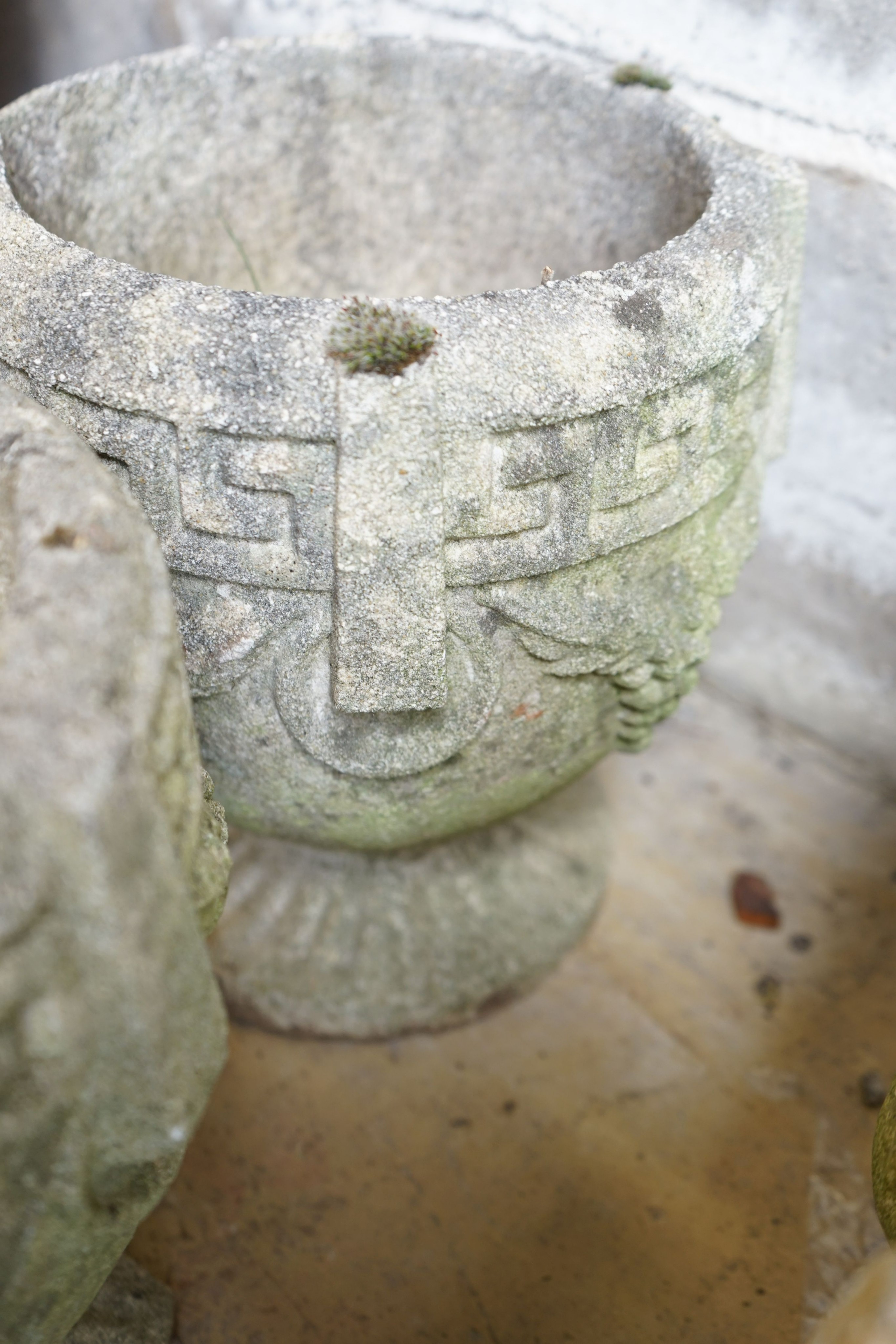 A pair of circular reconstituted garden planters, diameter 22cm